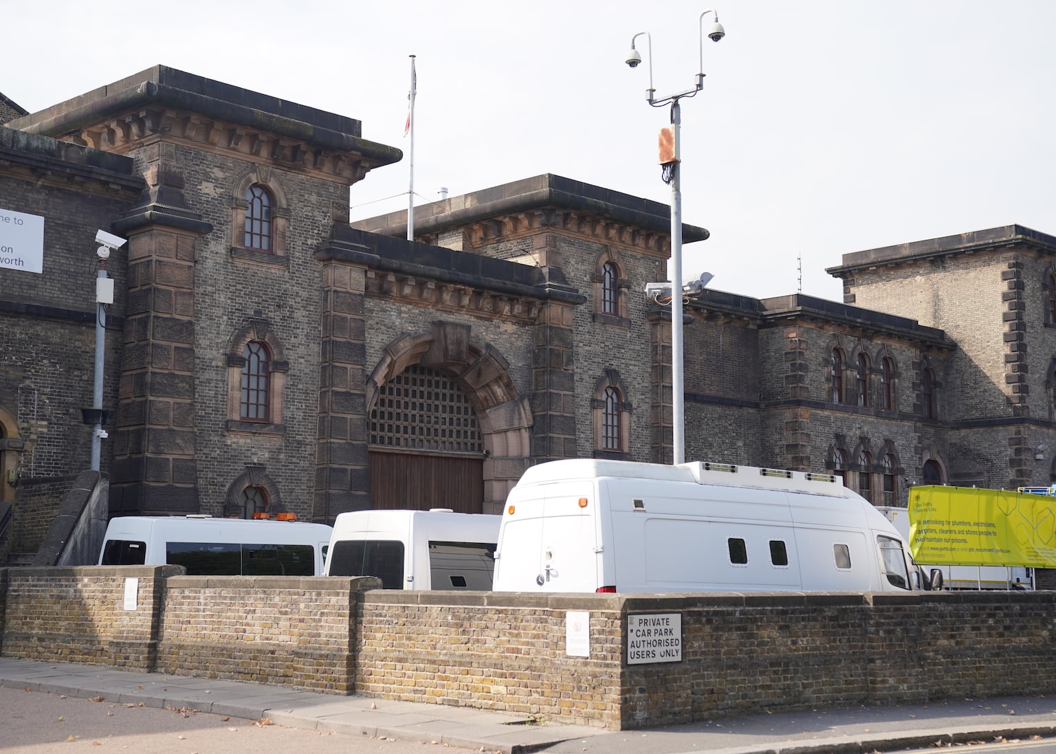 Prisoner hands himself in after three days, as manhunt continues for migrant