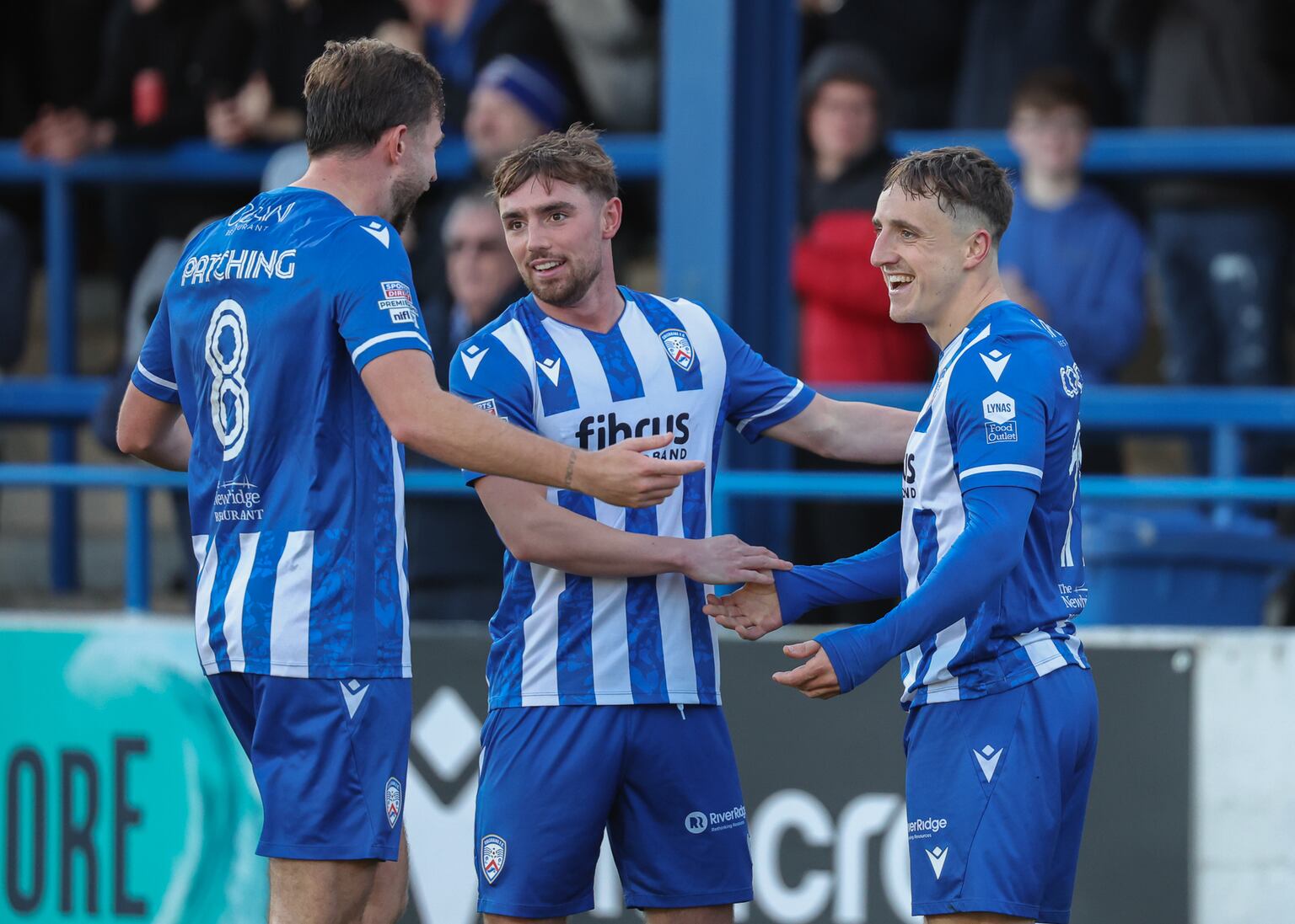Joel Cooper (right) after opening the scoring for Coleraine – the first of a hat-trick – against Glenavon at the Showgrounds