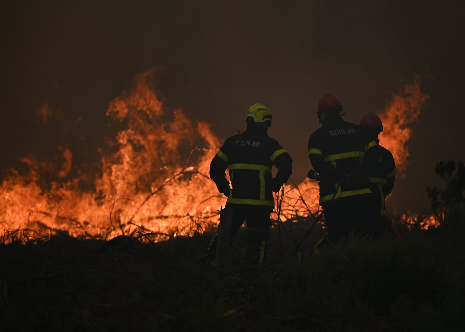 France and Spain battle wildfires as more than 250,000 people are forced to flee